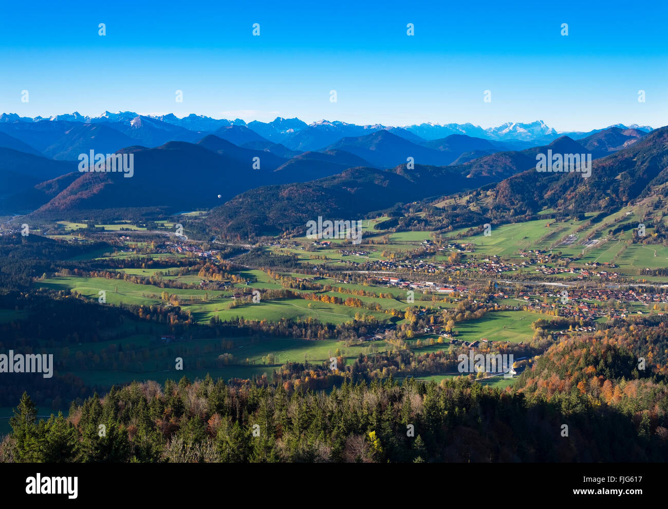 View from Geierstein mountain over the Isartal valley with Fleck and Wegscheid villages, Brauneck and Lenggries to the right Stock Photo