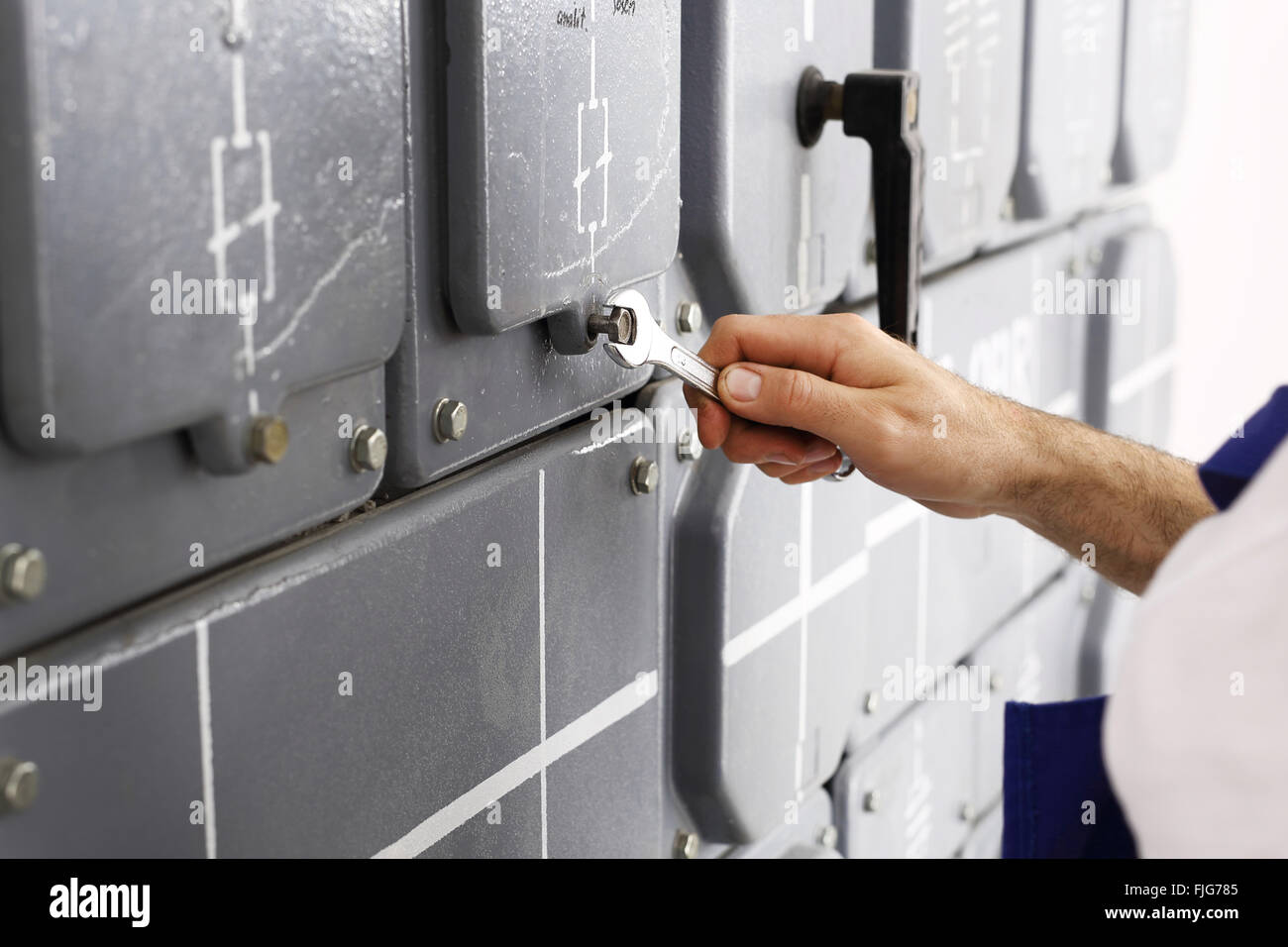 Electrician. Switching current home. Corks, electrical switches on the