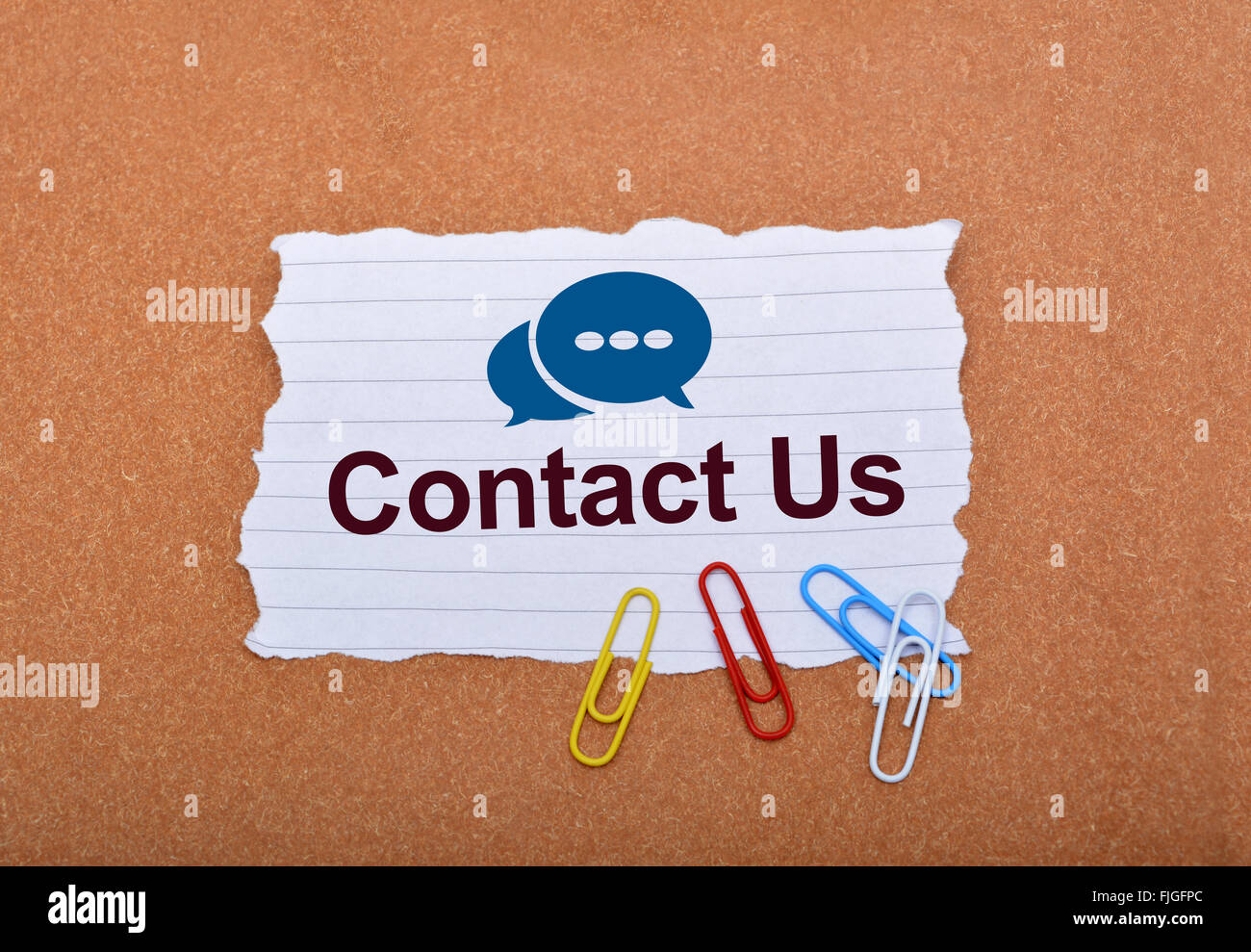 Contact Us with Speech Icons on Paper. Stock Photo