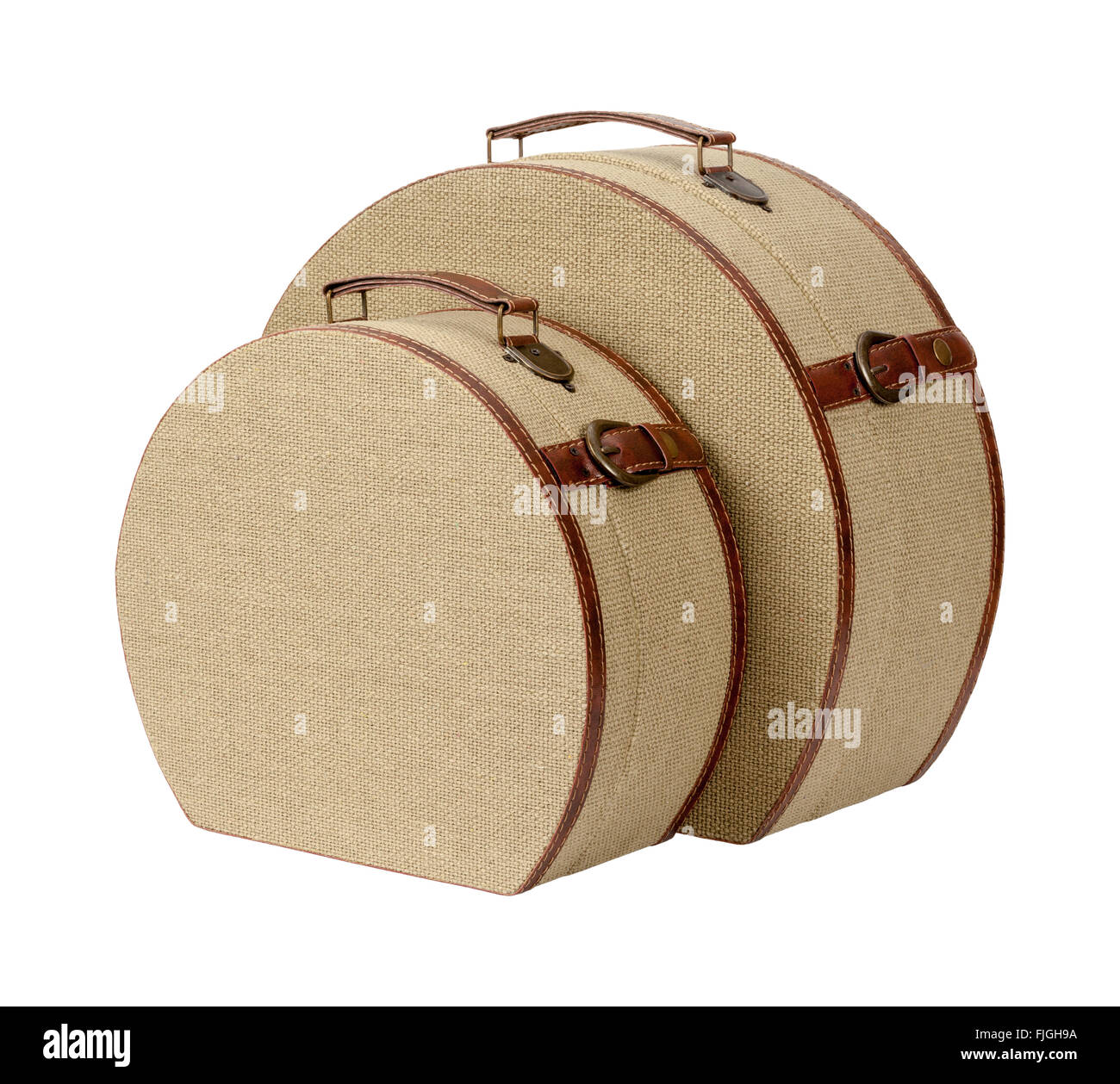 Two Round Deco Burlap Suitcases. The image is a cut out, isolated on a white background. Stock Photo