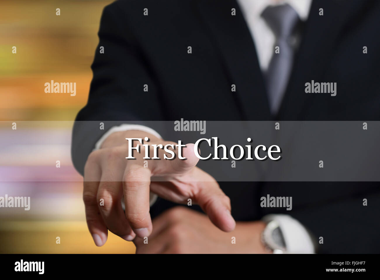 Businessman hand touching First Choice sign on virtual screen as Good Options concept. Stock Photo