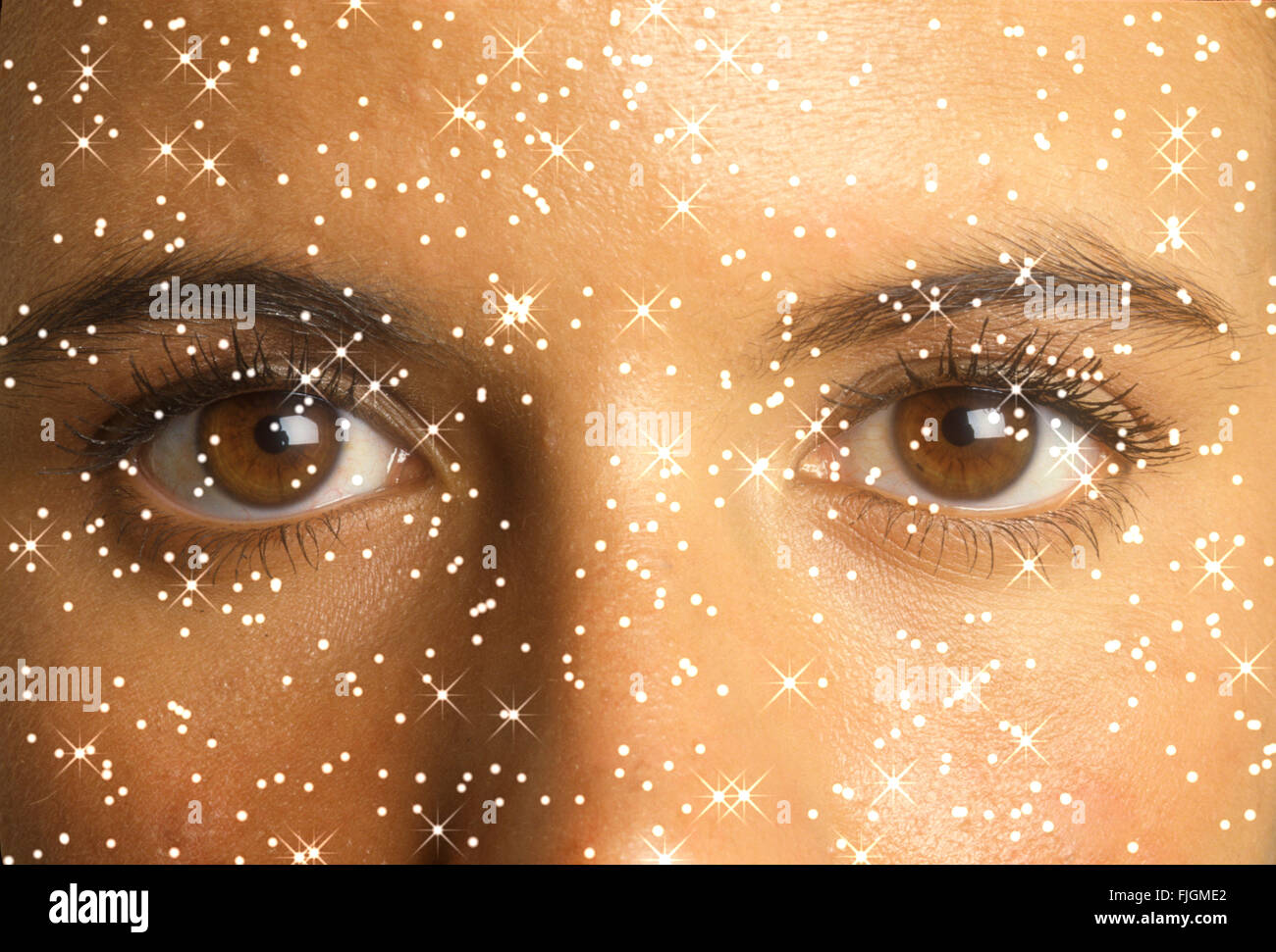 close up computer generated woman eyes with stars conceptual Stock Photo