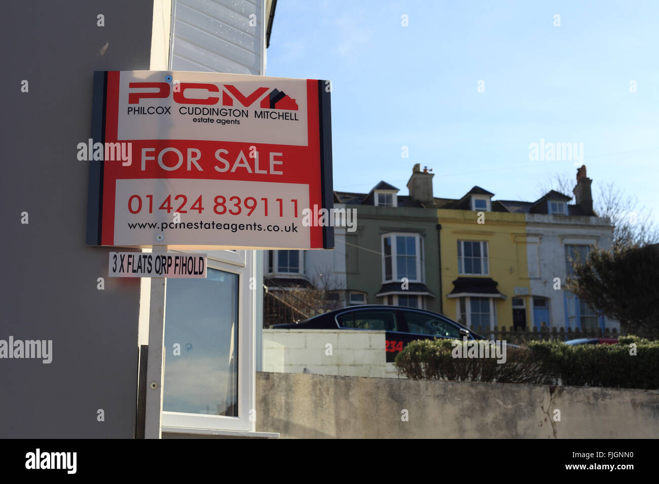 House for sale sign outside a property in Portland Place, Hastings, East Sussex Stock Photo