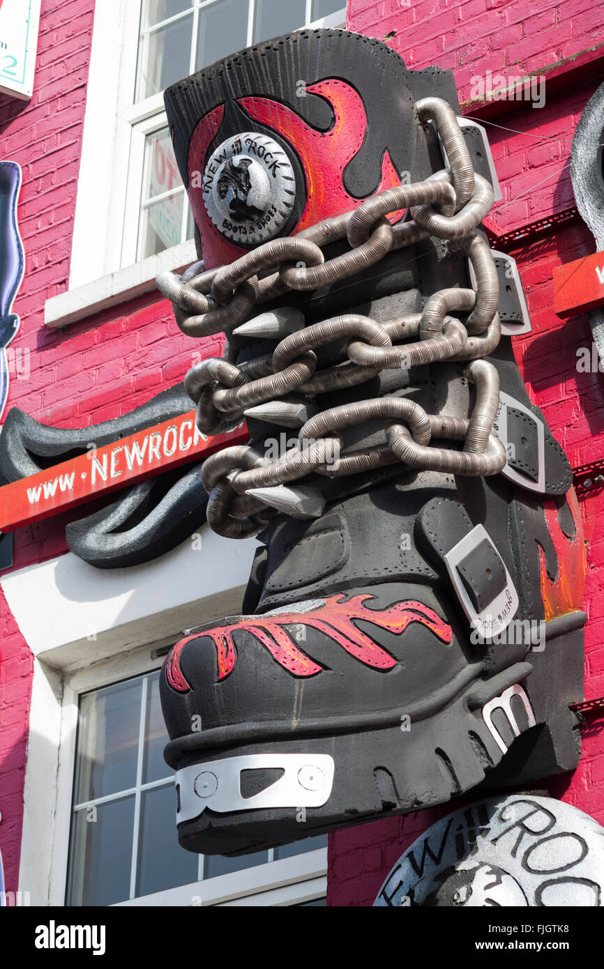 Large boot on New Rock boots & shoes shop facade at Camden High Street, London Stock Photo