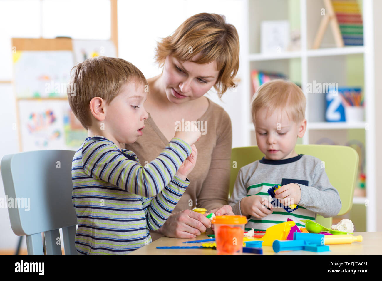 Mother and kids have a fun at home Stock Photo