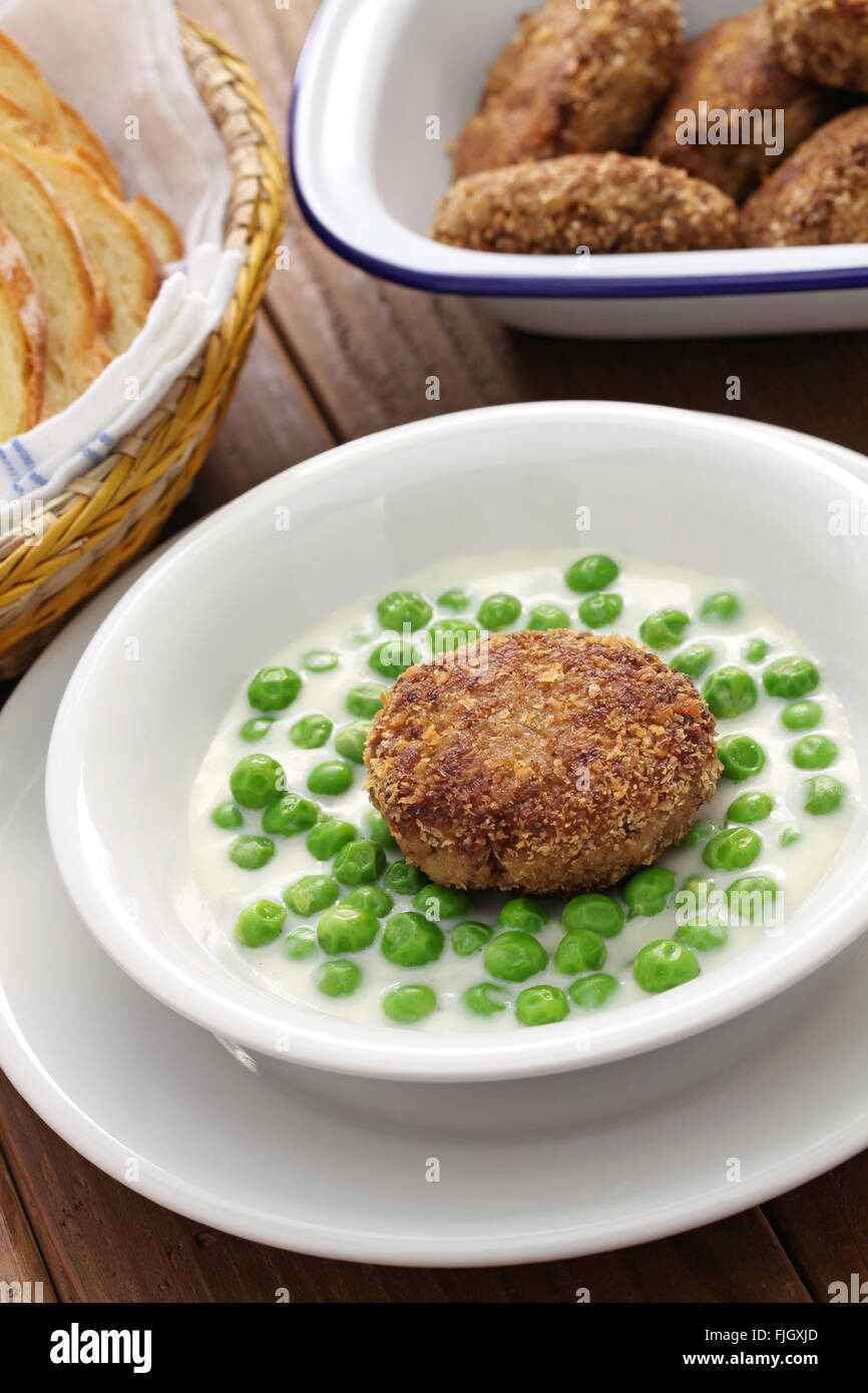 green peas fozelek (thick vegetable stew) and fasirt (fried meatball), hungarian cuisine Stock Photo