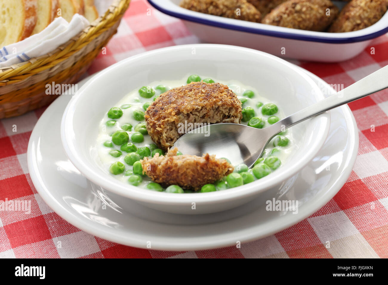 green peas fozelek (thick vegetable stew) and fasirt (fried meatball), hungarian cuisine Stock Photo