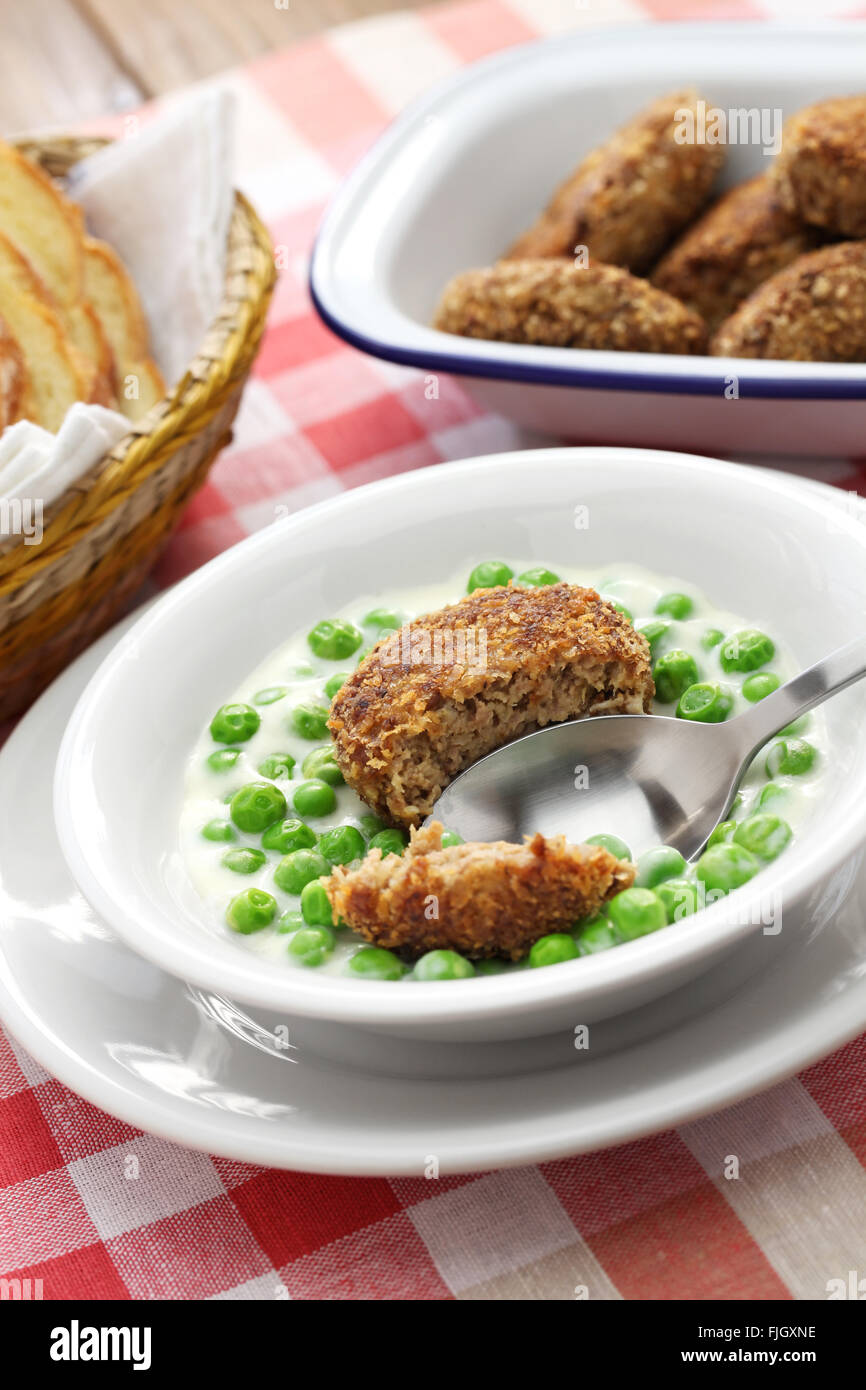 green peas fozelek (thick vegetable stew) and fasirt (fried meatball), hungarian cuisine Stock Photo
