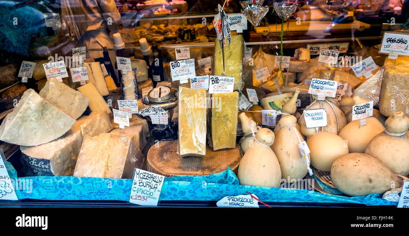 A wonderful shop window display of Italian cheeses in a delicatessen in Rome. This is part of the Volpetti shop in Rome, Italy. Stock Photo