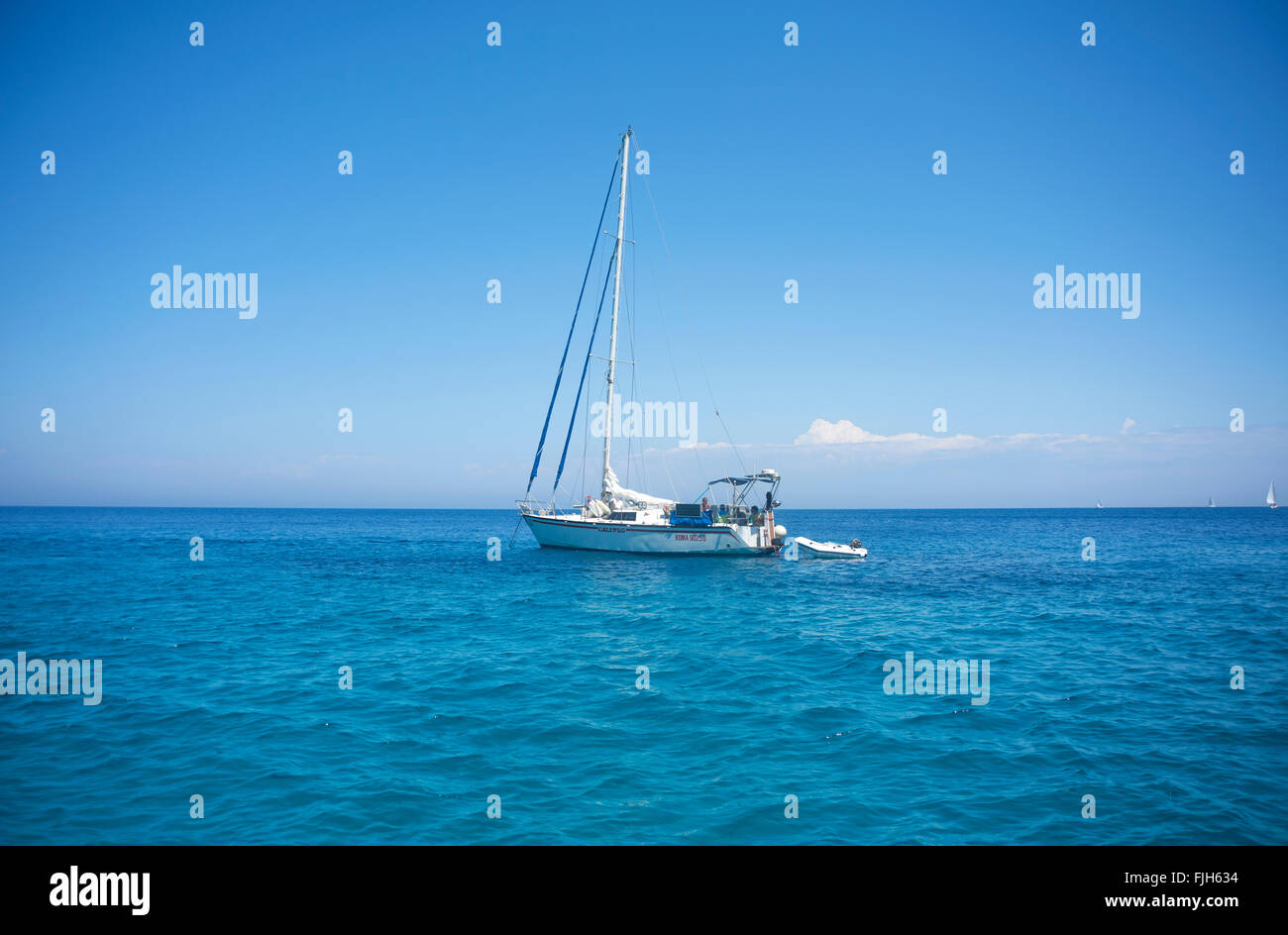 Sailing boat in the Ionian sea, off the coast of Zakynthos in Greece Stock Photo
