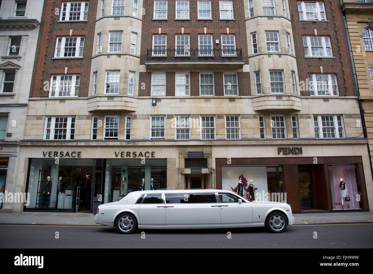 Stretch limousine Rolls Royce in Knightsbridge, London, UK. IN this wealthy part of West London, examples of extreme wealth and exclusive lifestyle are oppulantly on show everywhere you look. The choice of what car you drive or what clothes you wear all gives off an appearance of your rich status. Stock Photo