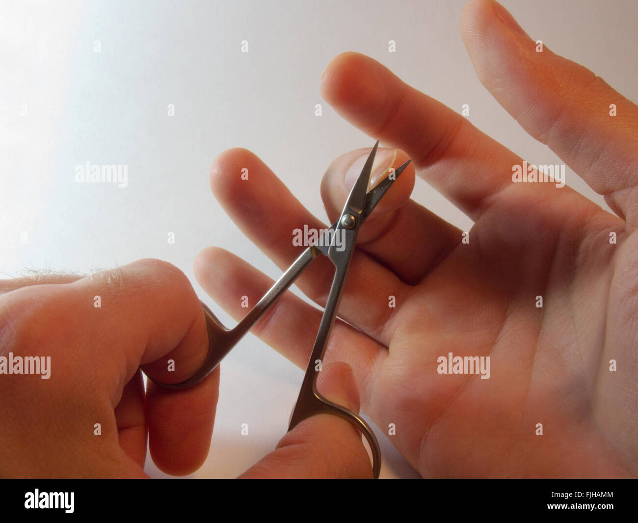 nail scissors, cutting nails, man's hand Stock Photo Alamy