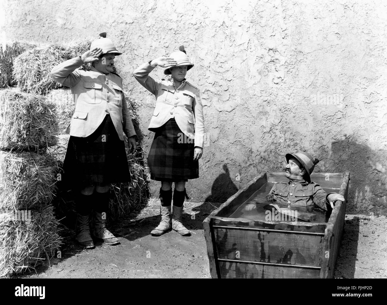 OLIVER HARDY, STAN LAUREL, JAMES FINLAYSON, BONNIE SCOTLAND, 1935 Stock Photo