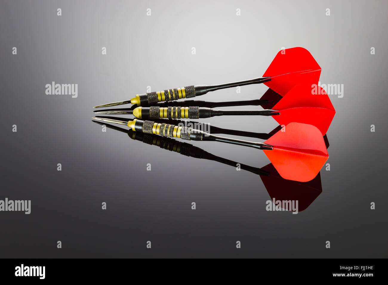 Red darts of the game Stock Photo - Alamy