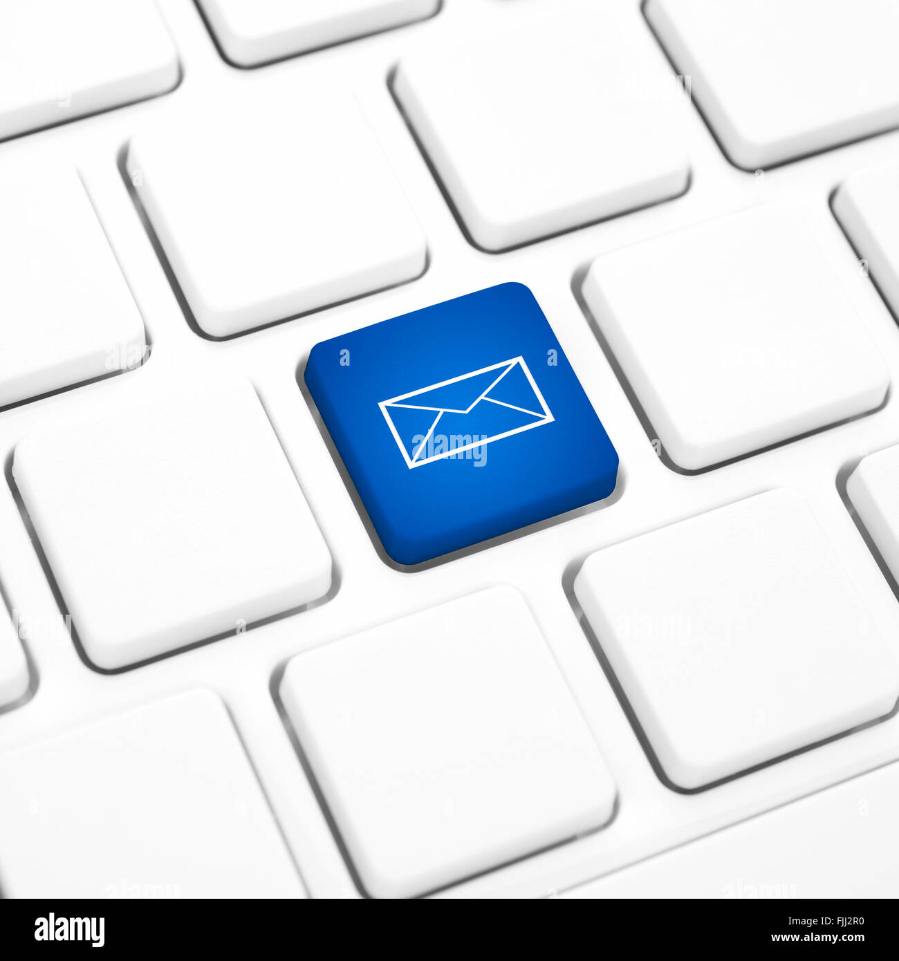 Web Mail network business concept, blue button or key on white keyboard. Stock Photo