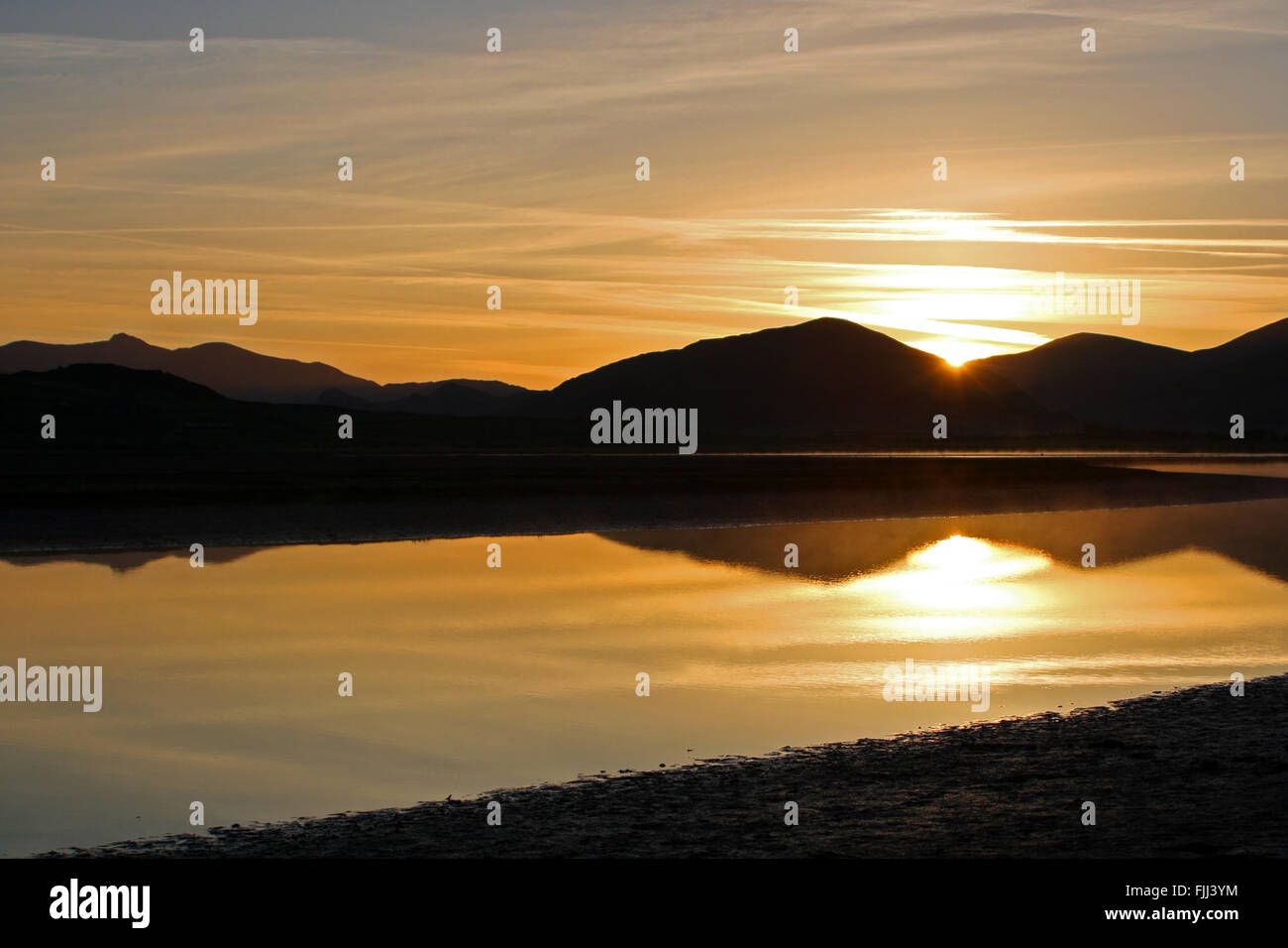 Sunrise at Broadwater lagoon at estuary of River Dysynni Tywyn and ...