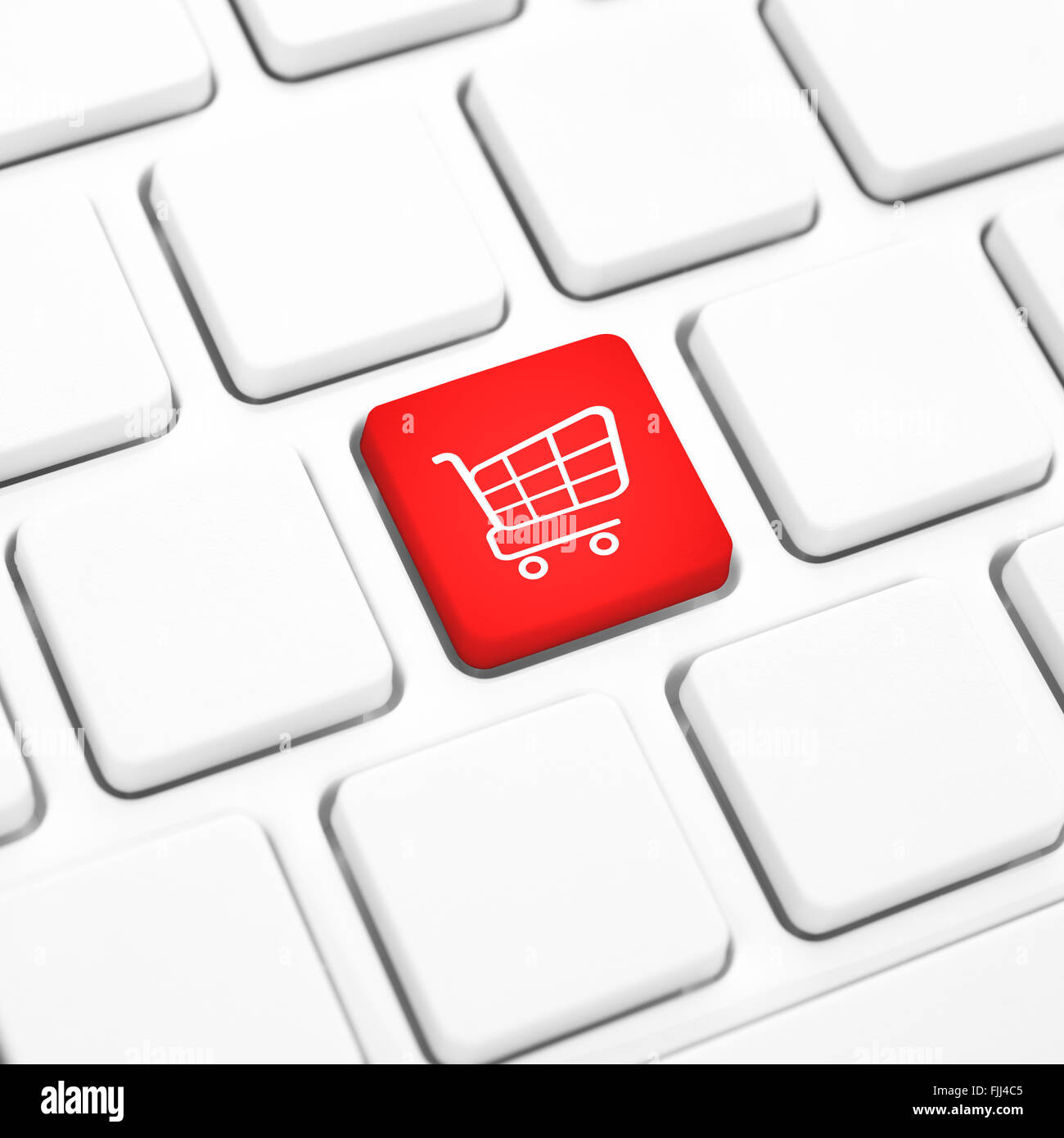 Shop online business concept, Red shopping cart button or key on white keyboard Stock Photo