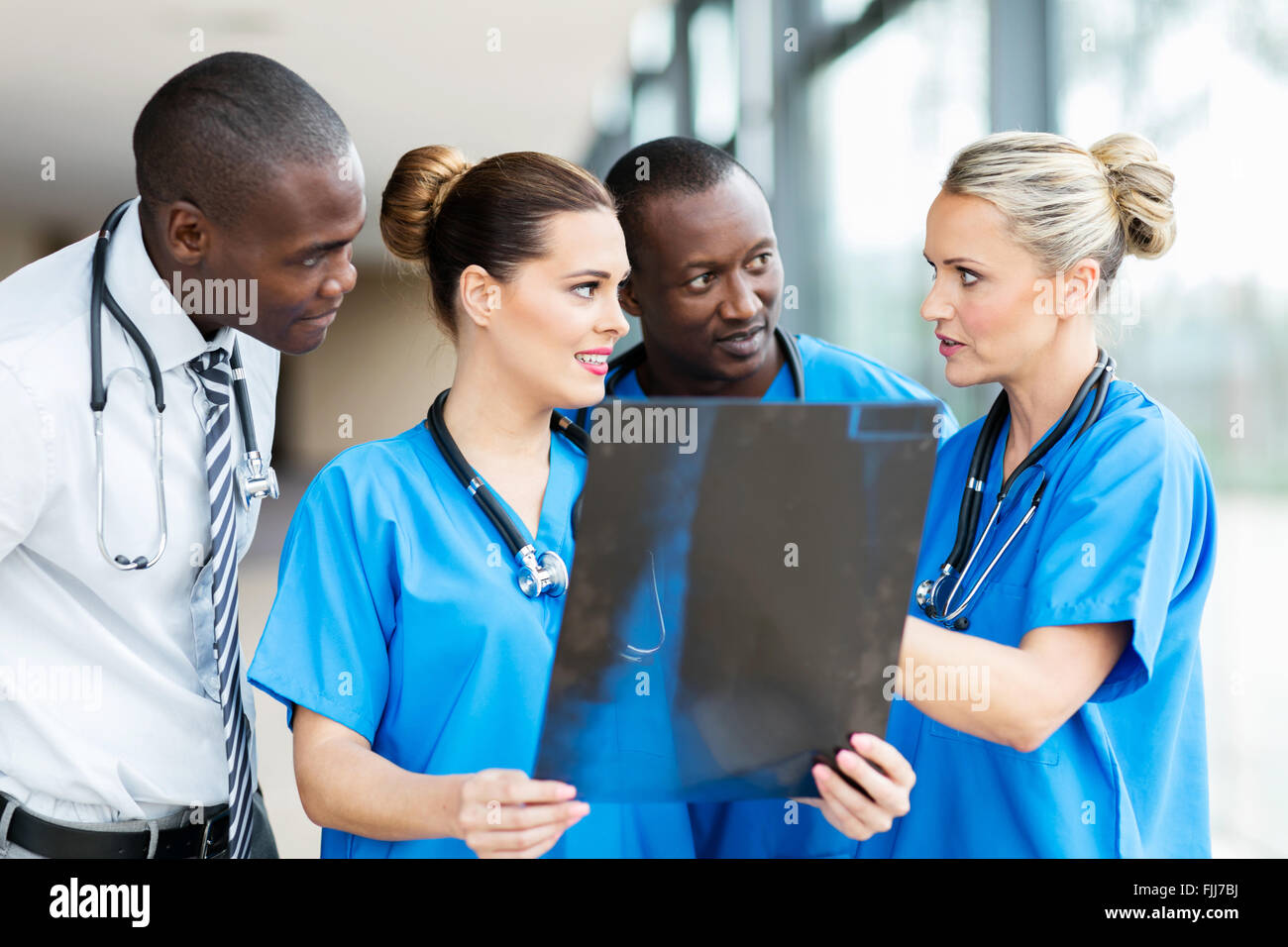 group of professional medical workers discussing patient's x-ray Stock Photo