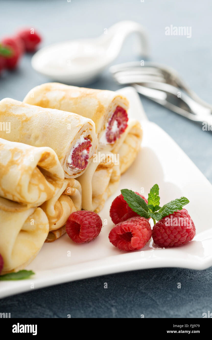 Crepes Filled With Cottage Cheese And Raspberry Stock Photo