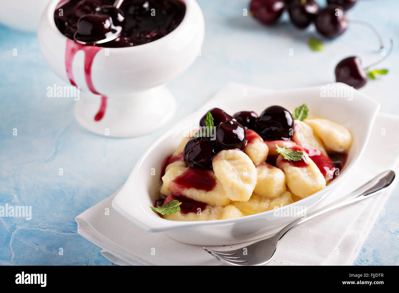 Cottage cheese gnocchi with cherry sauce Stock Photo Alamy