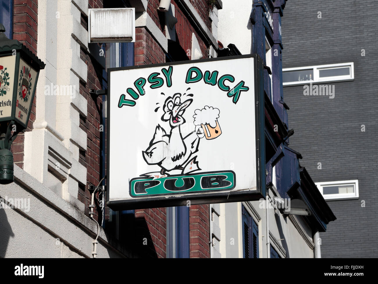 Sign above the Tipsy Duck public house in Eindhoven, Noord-Brabant,  Netherlands Stock Photo - Alamy
