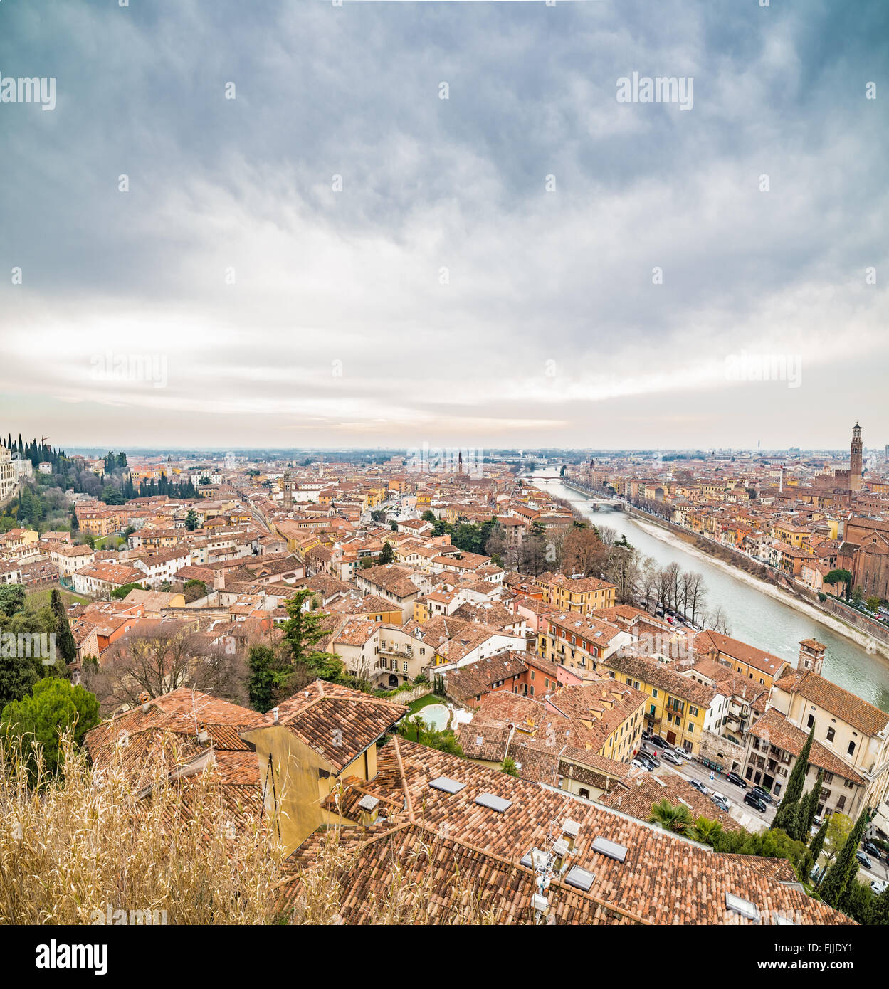 panorama of the Adige River as it passes through the houses and ...