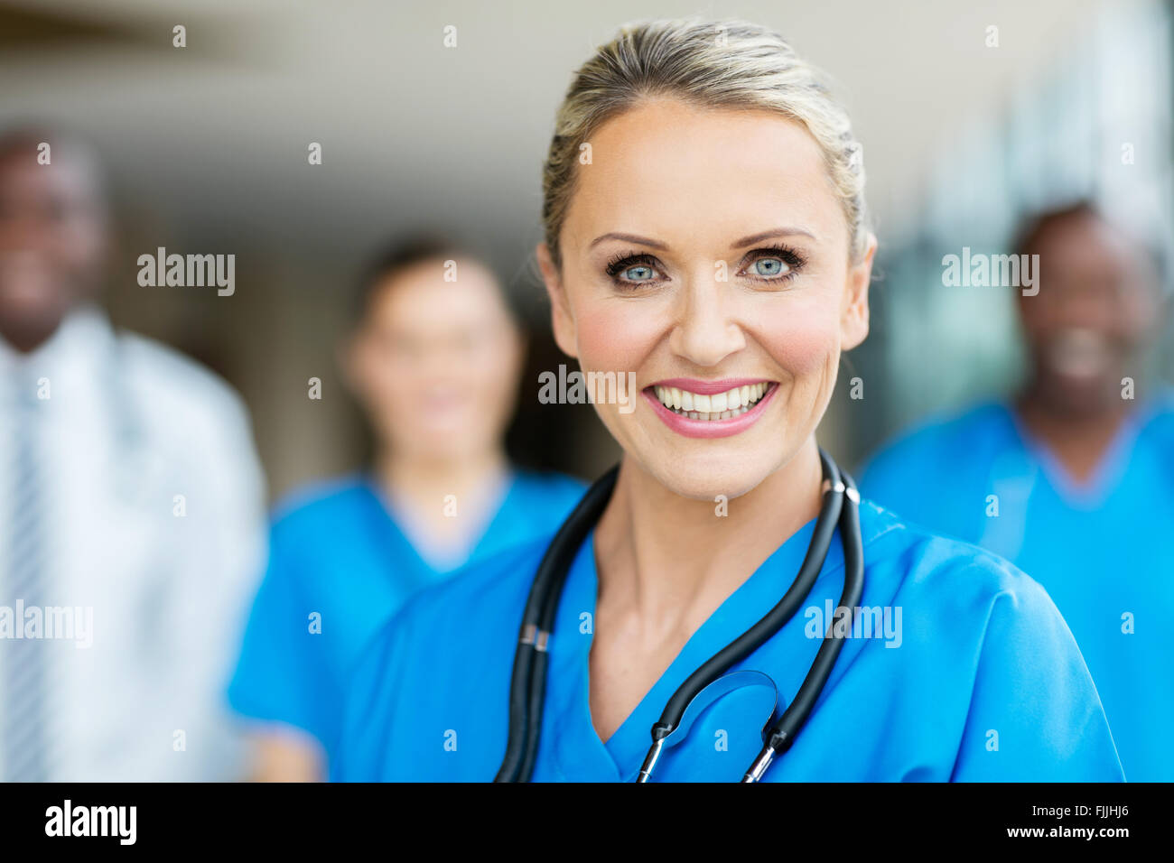 beautiful medical nurse and colleagues in hospital Stock Photo
