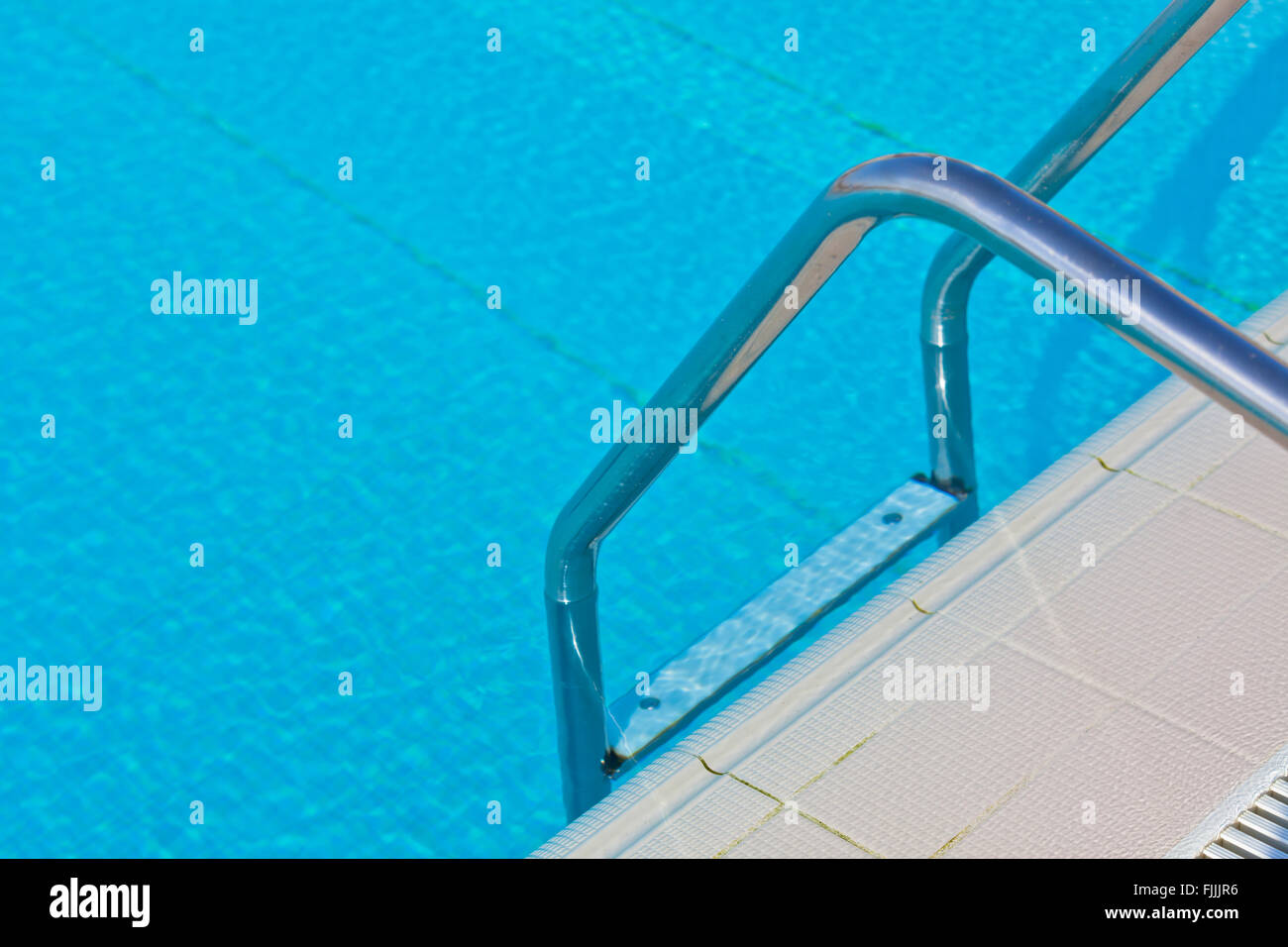 Ladder of a swimming pool. Horizontal shot Stock Photo - Alamy