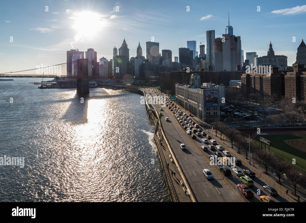 View from above the FDR drive highway in New York City with the Brooklyn Bridge, East River and downtown Manhattan skyline Stock Photo