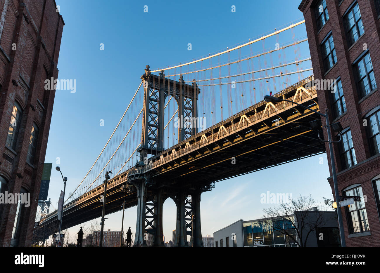 Street view from Dumbo of the Manhattan Bridge linking Manhattan to Brooklyn across the East River. Stock Photo
