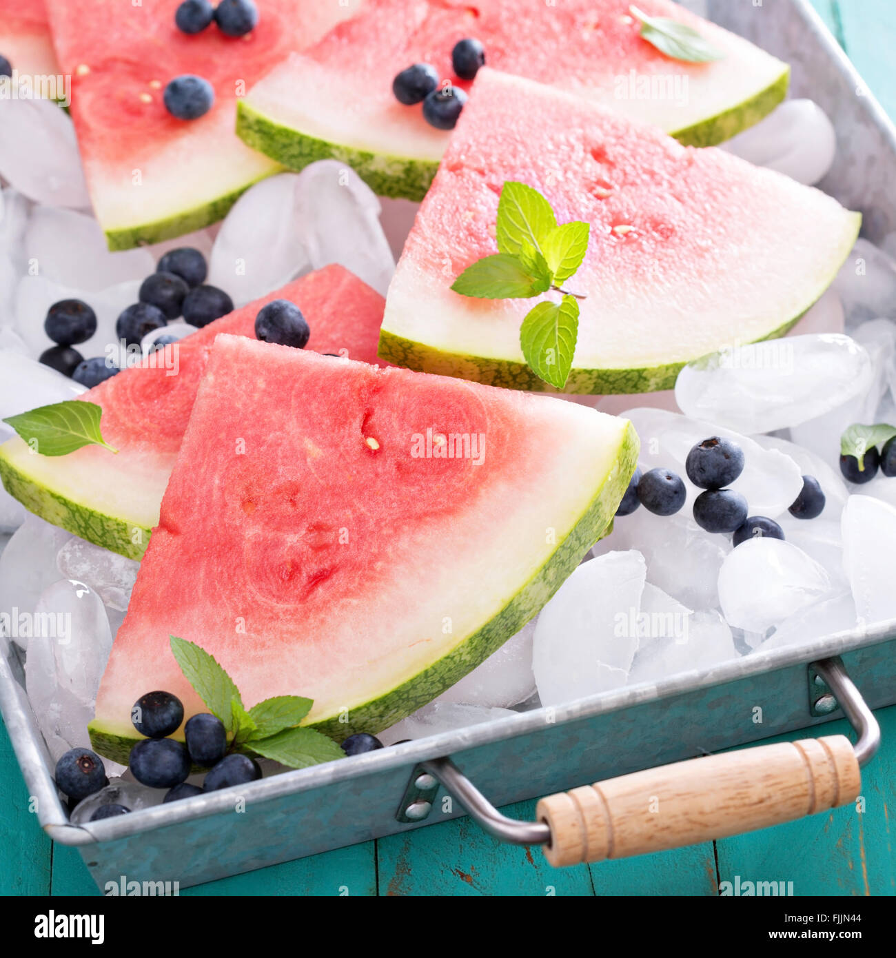 Watermelon slices on ice Stock Photo