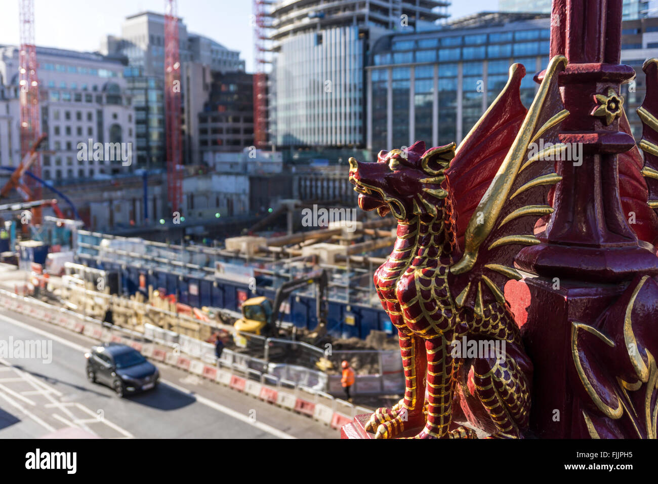 Dragon on Holborn Viaduct in the City of London with development site of new Goldman Sachs HQ in the background. Stock Photo