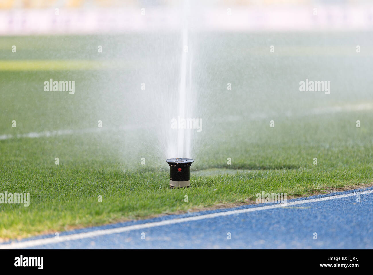 The irrigation system at football field Stock Photo Alamy