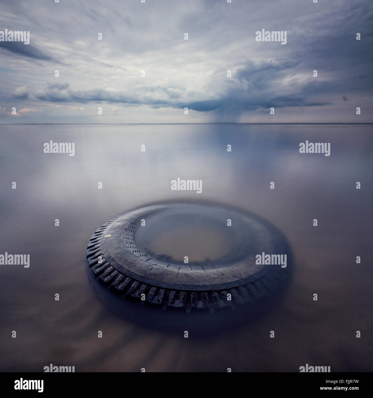 the Wheel in water with long exposure on storm background Stock Photo ...