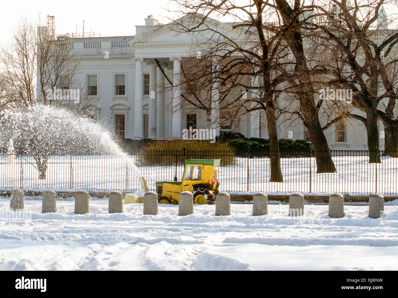 Washington, DC., USA, 8th January, 1996 The Blizzard of 1996 was a severe nor'easter that paralyzed the U.S. East Coast with up to 4 feet  of wind-driven snow from January 6 to January 8, 1996. It is one of only two snowstorms to receive the top rating of 5, or 'Extreme', on the Northeast Snowfall Impact Scale. Snowplows clearing the sidewalks and driveways around the White House after the blizzard. Credit: Mark Reinstein Stock Photo