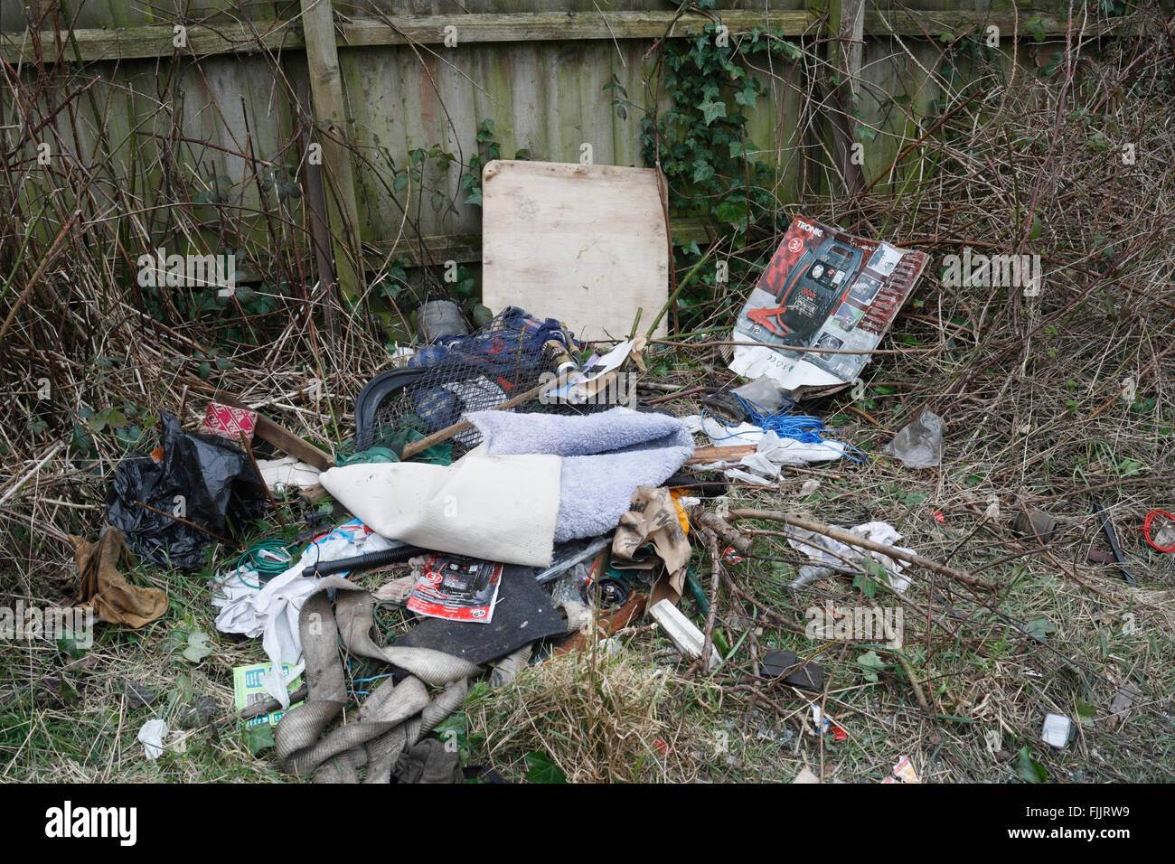 Fly Tipping, Rubbish dumped in back lane Stock Photo
