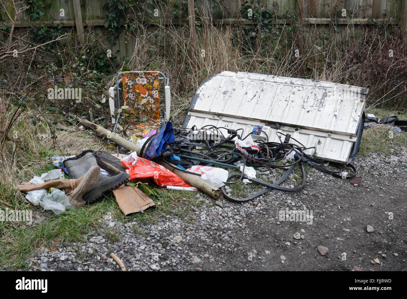 Fly Tipping, Rubbish dumped in back lane Stock Photo