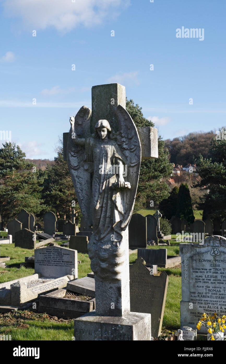 Cemetery angel statue sculpture on a grave UK Stock Photo