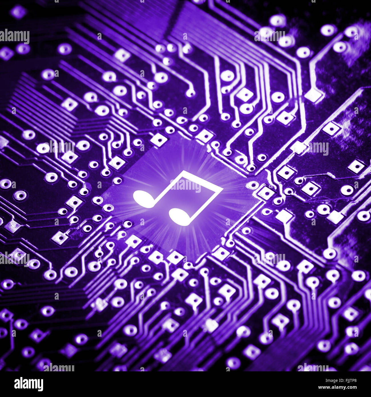 Music note on computer chip Stock Photo