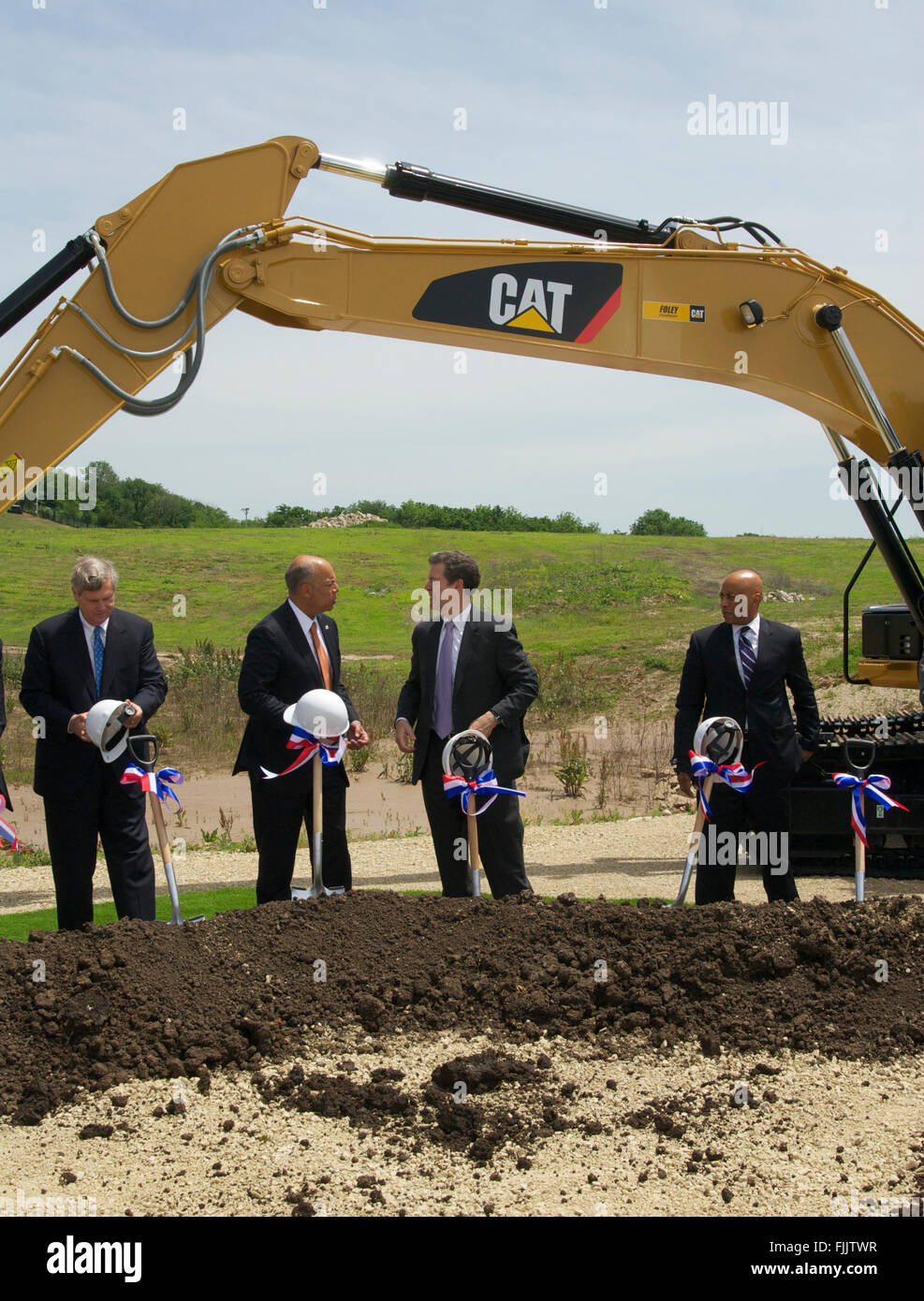 Manhattan, Kansas, USA, 27th May, 2015 L-R ) Secretary of Agriculture Tom Vilsack,  Secretary of Department of Homeland Security Jeh Jonson and Kansas Governor Sam Brownback Dr. Reginald Brothers Under Secretary for Science and Technology at DHS. Talk with one another after the official groundbreaking ceremony of the new biocontainment building on the campus of KState today.  Credit: Mark Reinstein Stock Photo