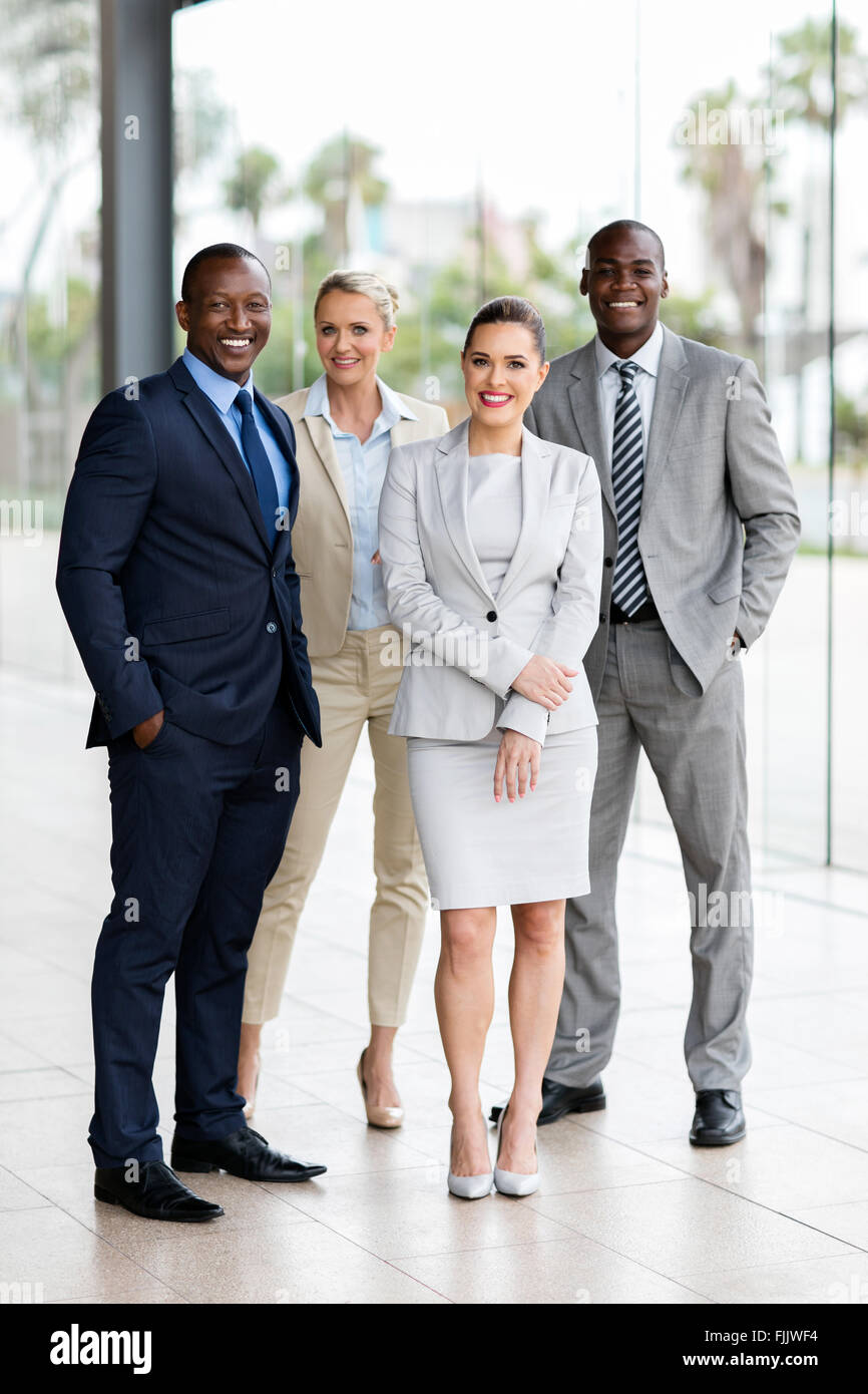 group of multiracial businesspeople standing together in office Stock ...
