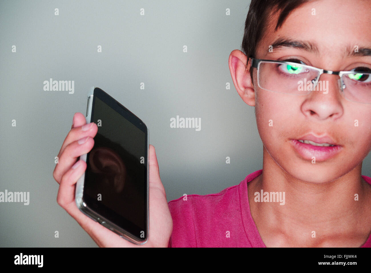 boy holding smart phone Stock Photo