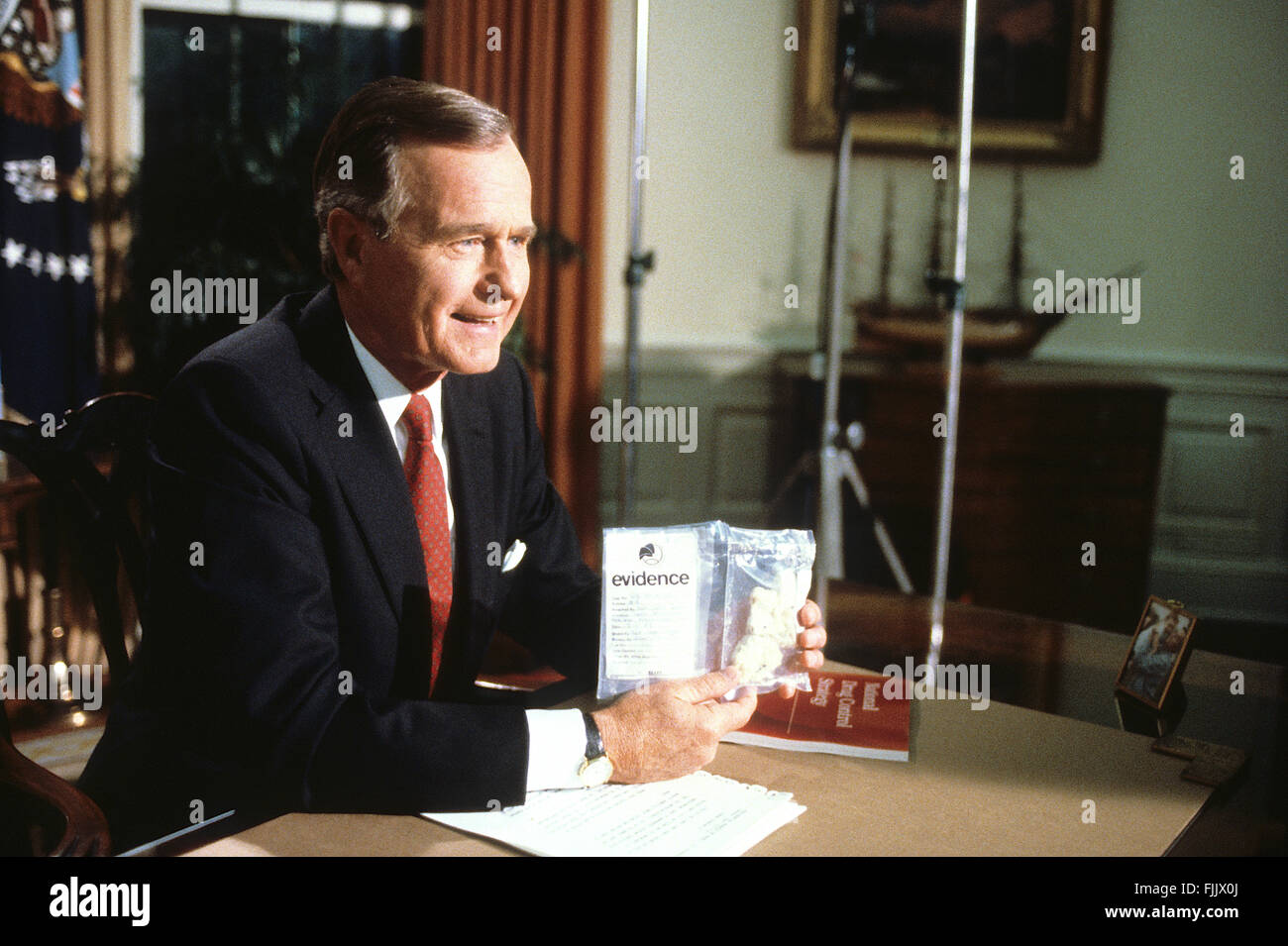 Washington, DC., 5th September, 1989 President George H.W. Bush holds up a bag of crack cocaine during his first address to the nation from the Oval Office. 'This is crack cocaine, it was seized a few days ago in a park across the street from the White House' he said showing how the drug trade had spread to even the president's own neighborhood. The three ounces of crack were purchased for $2,400 by  DEA agents from a drug dealer that they lured to Lafayette Park across the street from the White House.  Credit: Mark Reinstein Stock Photo