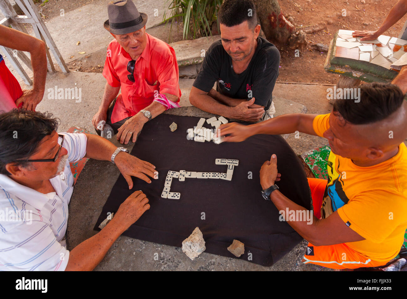 Ticos playing Dominos in a park in Quepos, Puntarenas Province, Costa Rica. Stock Photo