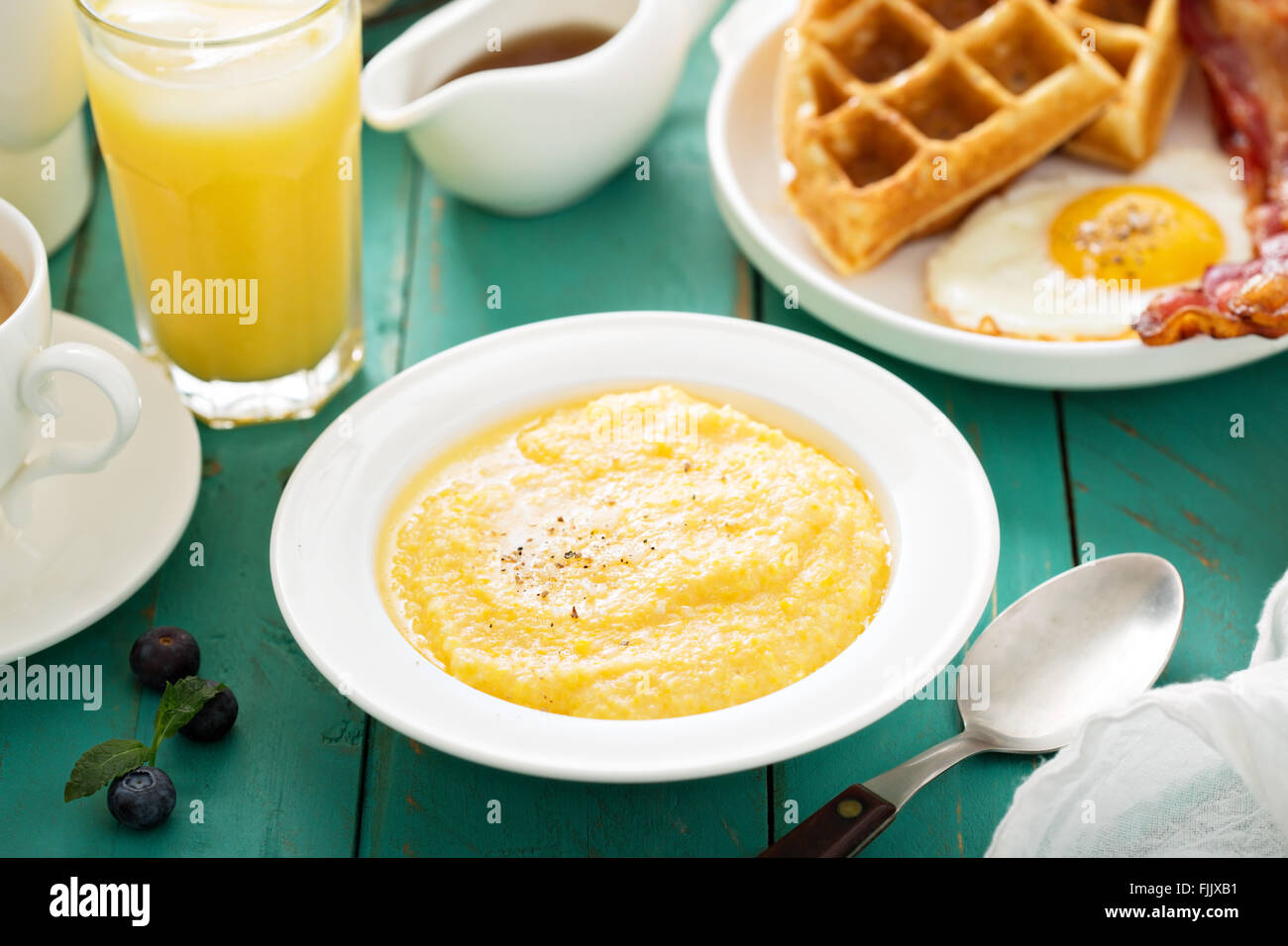 Cheesy grits for breakfast Stock Photo Alamy