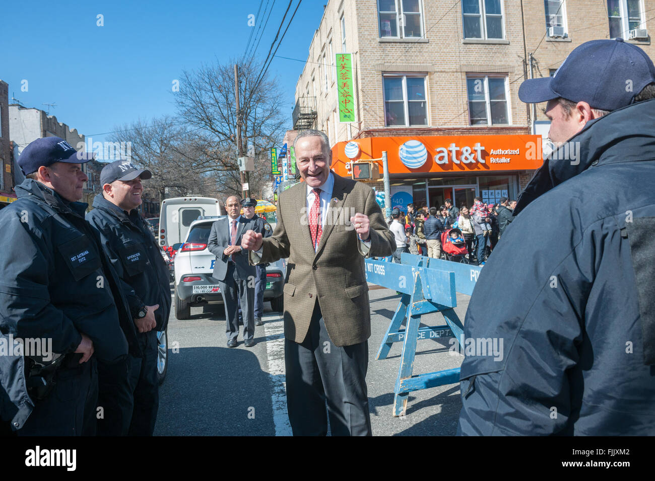 NY Senator Charles Schumer greets police officers Eighth Avenue in the Sunset Park neighborhood in Brooklyn in New York on Sunday, February 28, 2016 during the Lantern Festival street fair. Sunset Park has become Brooklyn's Chinatown as Chinese and other Asian groups have moved there and businesses have sprouted up to cater to them. (© Richard B. Levine) Stock Photo