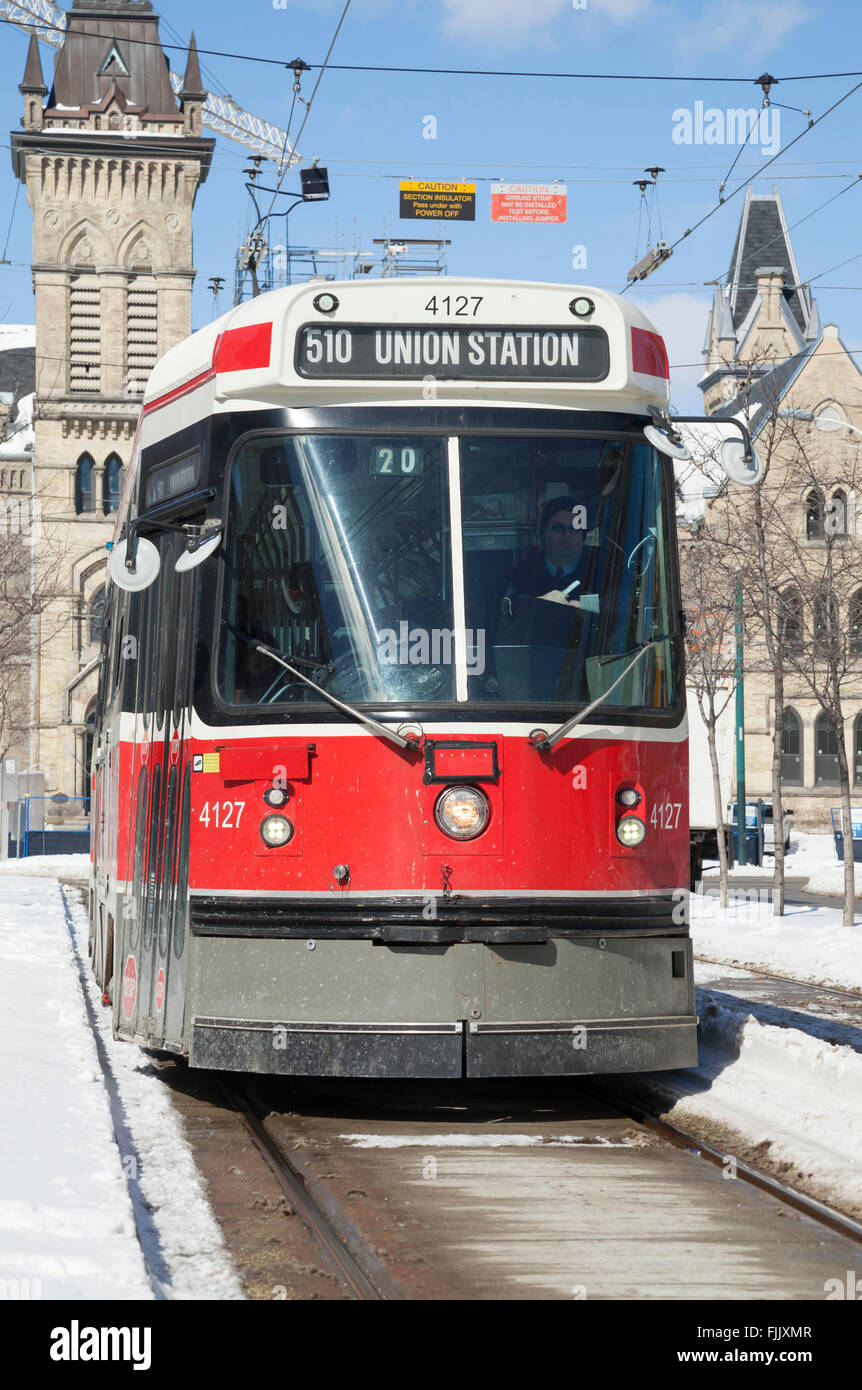 Street car of the Toronto Transit Commission travels through down town Toronto in the snow Stock Photo