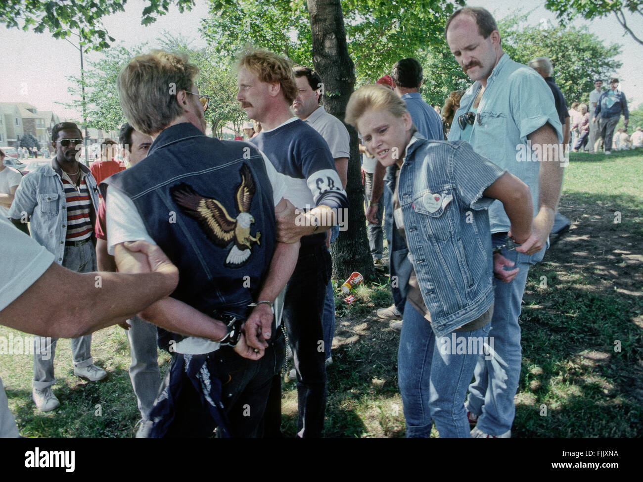 Chicago, Illinois, USA,  September, 1988 KKK and Nazis Rally in Marquette Park Chicago. Undercover police officers arrest a couple of white power demonstrators during the rally in Marquette Park.  Credit: Mark Reinstein Stock Photo