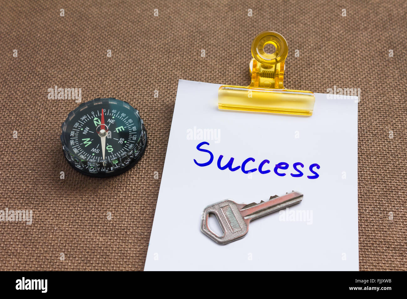 compass with text success in business concept and key background Stock Photo