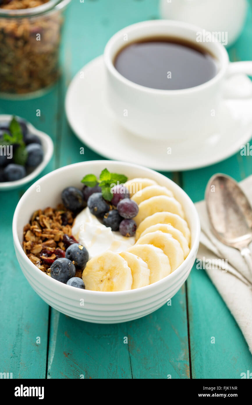 Granola bowl with yogurt and banana Stock Photo